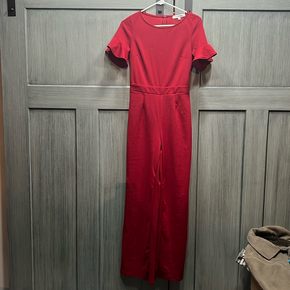 The Vanity Room red jumpsuit with fluted sleeves. Size S.